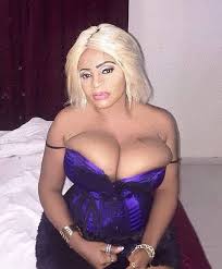 Cossy Ojiakor's boobs nearly spill out of her skimpy dress