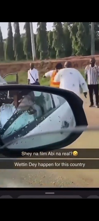 Scary Moment Angry Motorist Cocks & Points Gun At VIO Officer In Abuja (video) - Crime - Nigeria